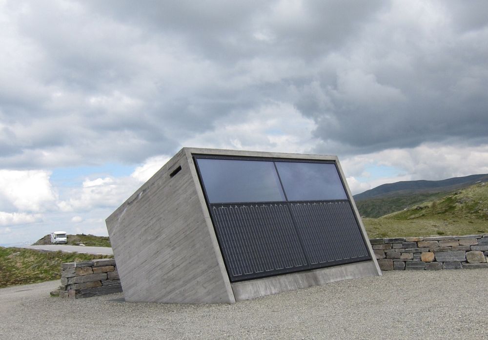Concrete toilet building with solar panels on the Aurland mountain road